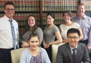Dade Legal Aid staff attorneys Steve Paulson, Alexandra Mesa, Stephanie Grosman, Evita Féria Laguna and Mark Brown (back row) hosted Cornell Law students Michaela Kamemoto and Weigang Meng during spring break.
