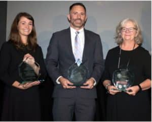 Attorneys Katy DeBriere of JALA, Jeffrey Hearne of Legal Services of Greater Miami, and Kathy Grunewald of Florida Legal Services accept the second runner-up Goldstein Award. 