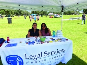 Equal Justice Works Fellow Daniela Donoso, left, with Legal Services of North Florida staff at a community event